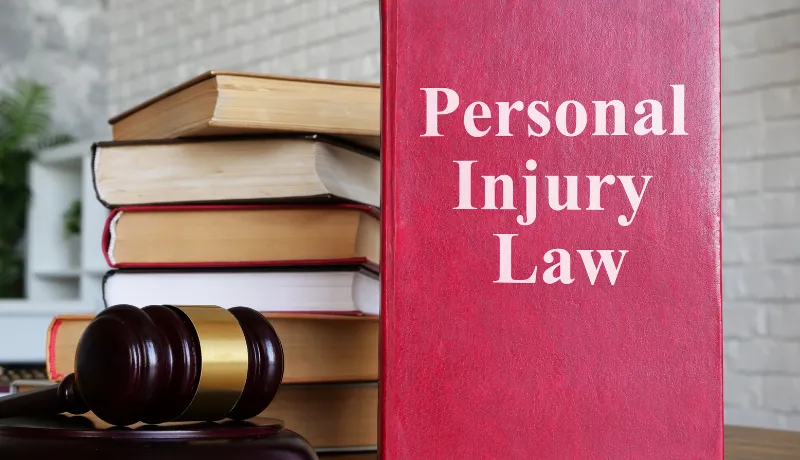 Personal injury law is shown using a text on the book