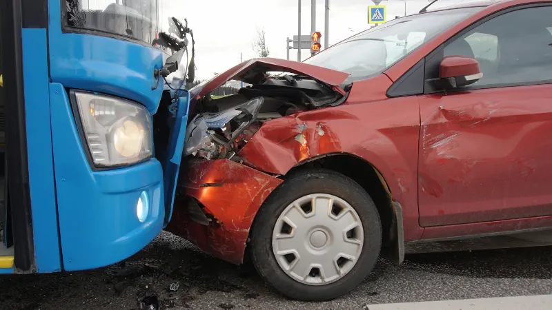 Frontal collision of a car and a bus. Head-on collision between bus and car. Car accident.