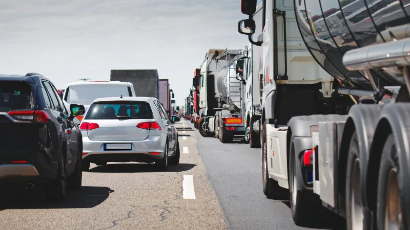 Cars and truck in traffic jam congestion at highway