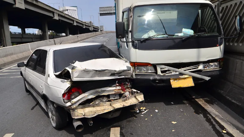 Two cars crash on the road