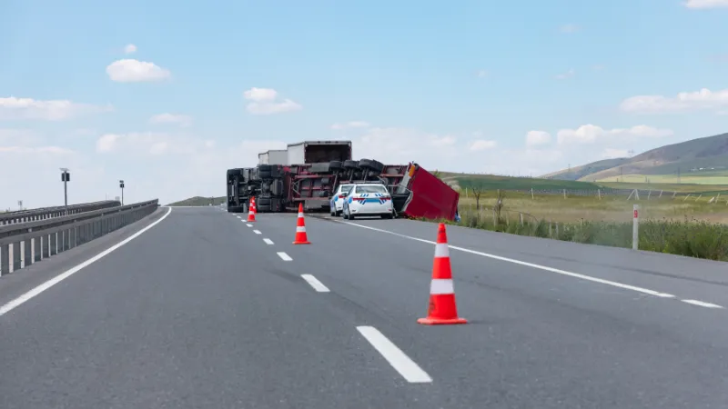 An overloaded and fast truck (TIR) overturned on an interurban road -