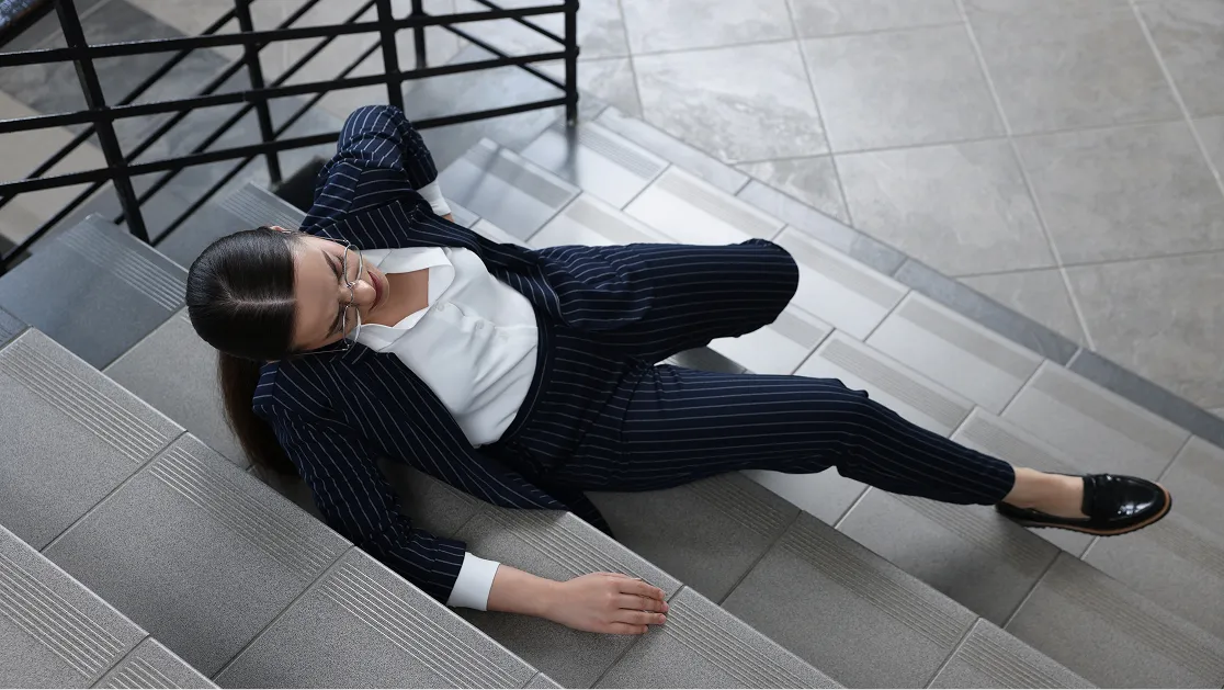 A woman who slipped and fell from the stairs is lying down