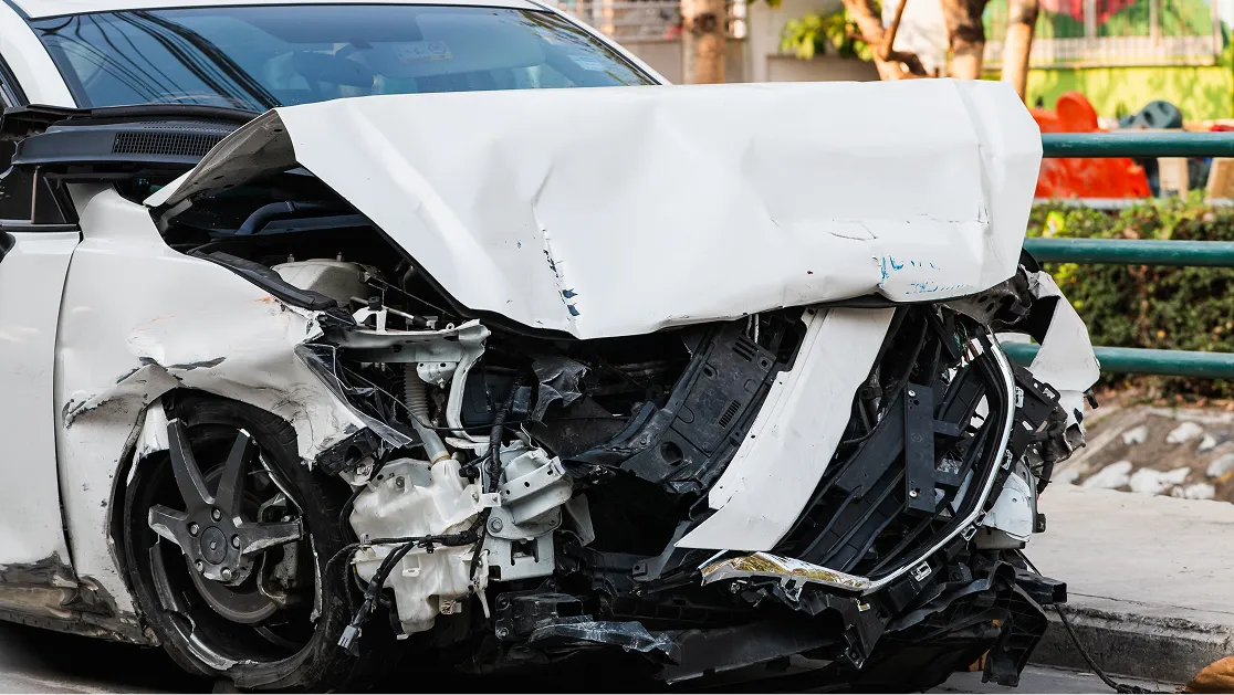 A damaged white car.